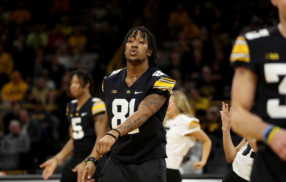 Members of the Hawkeye Football team performs with the Iowa Dance Team at halftime of the Iowa Hawkeyes game against the Ohio State Buckeyes Thursday, February 20, 2020 at Carver-Hawkeye Arena. (Brian Ray/hawkeyesports.com)