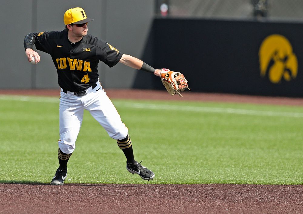 Iowa Hawkeyes second baseman Mitchell Boe (4) throws to first for an out during the fourth inning of their game against Rutgers at Duane Banks Field in Iowa City on Saturday, Apr. 6, 2019. (Stephen Mally/hawkeyesports.com)
