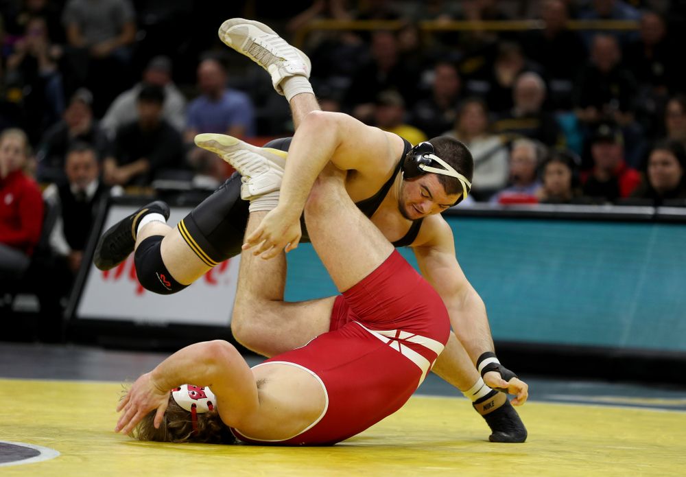 IowaÕs Tony Cassioppi wrestles WisconsinÕs Trent Hillger at heavyweight Sunday, December 1, 2019 at Carver-Hawkeye Arena. Cassioppi won the match 3-2. (Brian Ray/hawkeyesports.com)