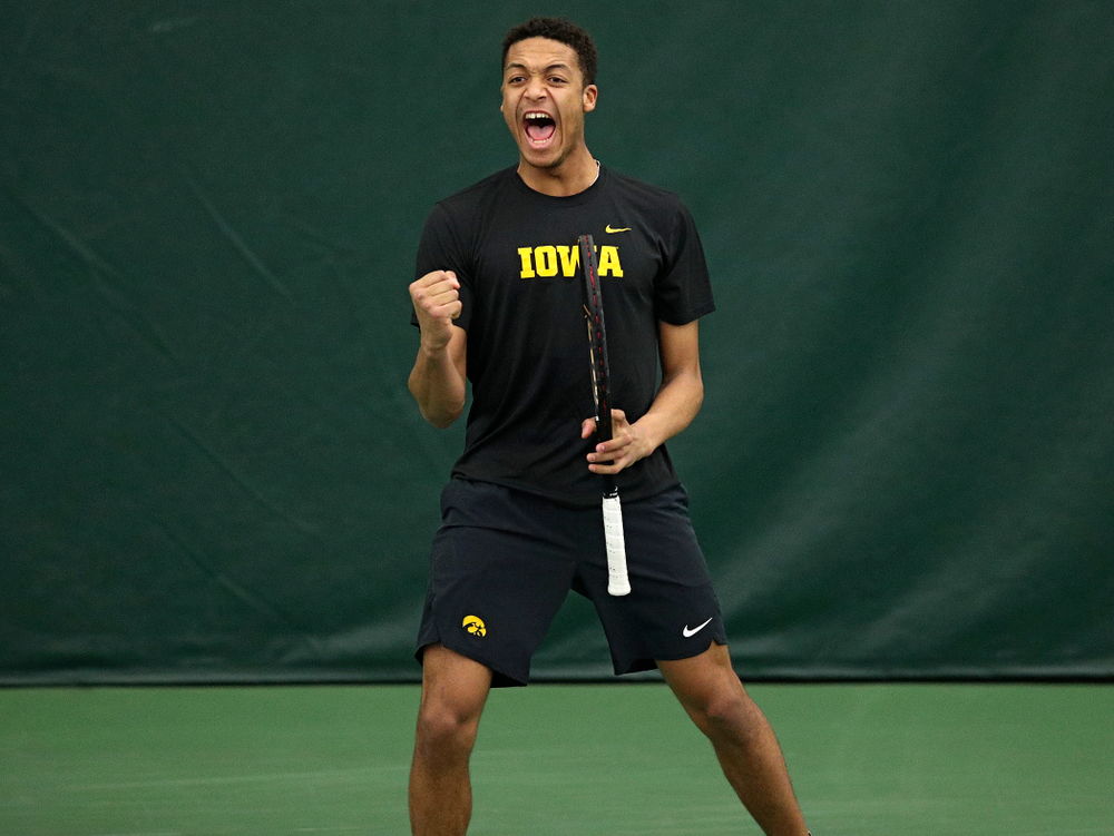 Iowa’s Oliver Okonkwo celebrates a point during his doubles match at the Hawkeye Tennis and Recreation Complex in Iowa City on Friday, March 6, 2020. (Stephen Mally/hawkeyesports.com)