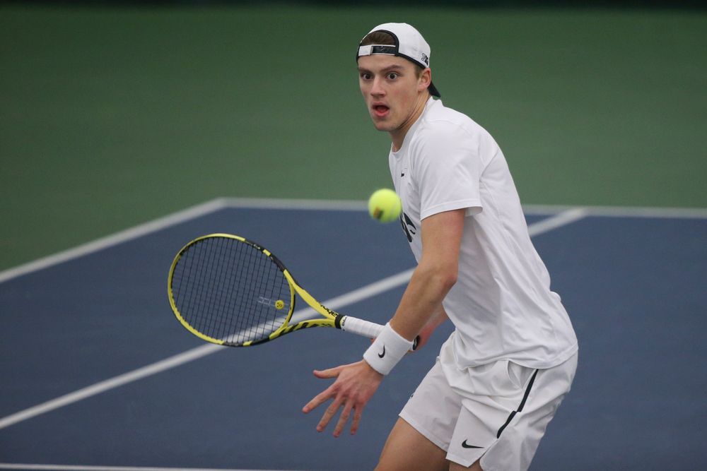 Iowa’s Joe Tyler returns a hit during the Iowa men’s tennis meet vs Nebraska on Sunday, March 1, 2020 at the Hawkeye Tennis and Recreation Complex. (Lily Smith/hawkeyesports.com)