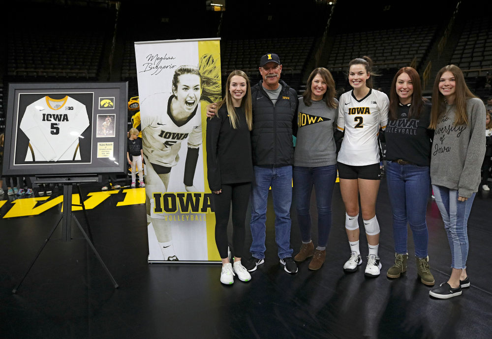 Iowa’s Meghan Buzzerio (5) is honored with her family on Senior Day before their match at Carver-Hawkeye Arena in Iowa City on Saturday, Nov 30, 2019. (Stephen Mally/hawkeyesports.com)