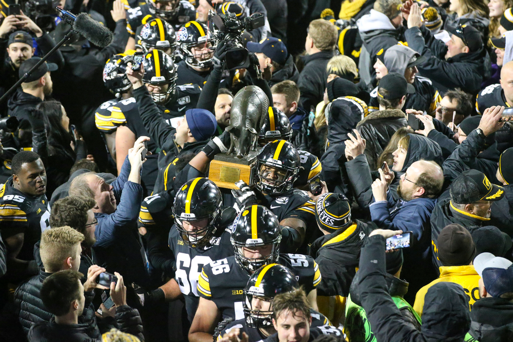 Iowa Hawkeyes carry the Floyd of Rosedale after Iowa football vs Minnesota on Saturday, November 16, 2019 at Kinnick Stadium. (Lily Smith/hawkeyesports.com)