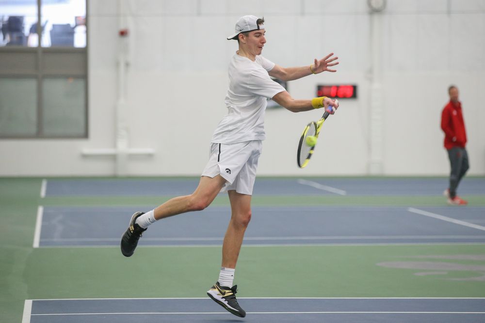 Iowa’s Nikita Snezhko returns a hit during the Iowa men’s tennis meet vs Nebraska on Sunday, March 1, 2020 at the Hawkeye Tennis and Recreation Complex. (Lily Smith/hawkeyesports.com)