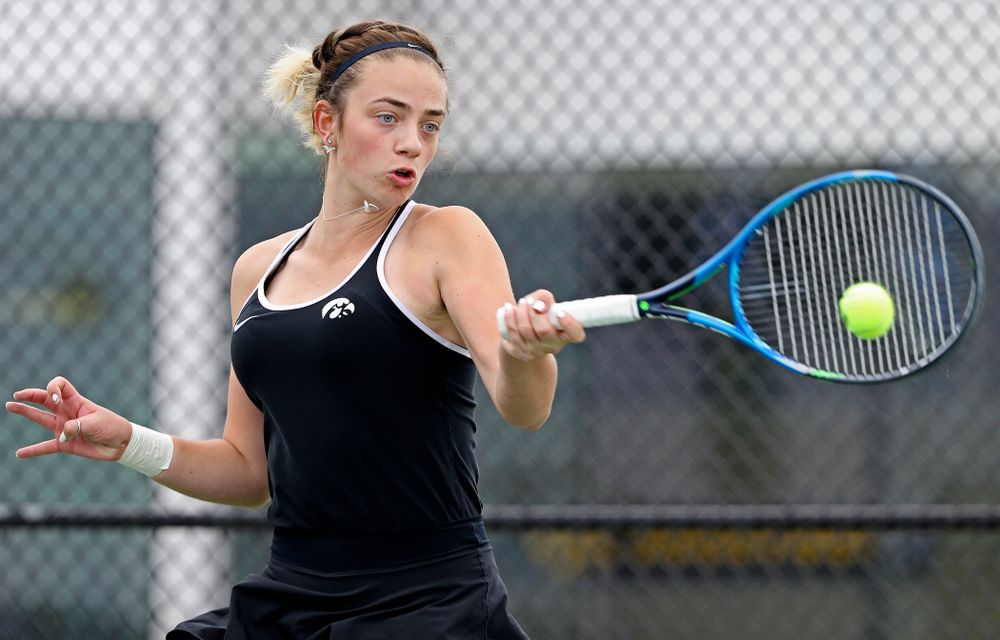 Iowa's Sophie Clark returns a shot during their doubles match against Rutgers at the Hawkeye Tennis and Recreation Complex in Iowa City on Friday, Apr. 5, 2019. (Stephen Mally/hawkeyesports.com)