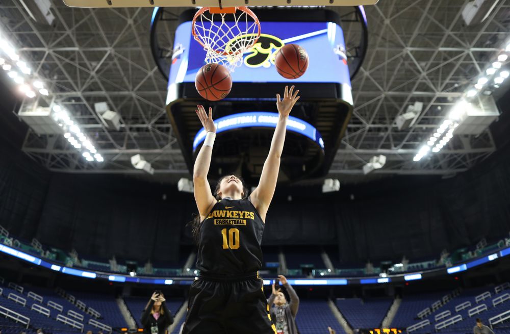 Iowa Hawkeyes forward Megan Gustafson (10) does the Mikan Drill the ESPN Crew following practice for their Sweet 16 matchup against NC State Friday, March 29, 2019 at the Greensboro Coliseum in Greensboro, NC.(Brian Ray/hawkeyesports.com)