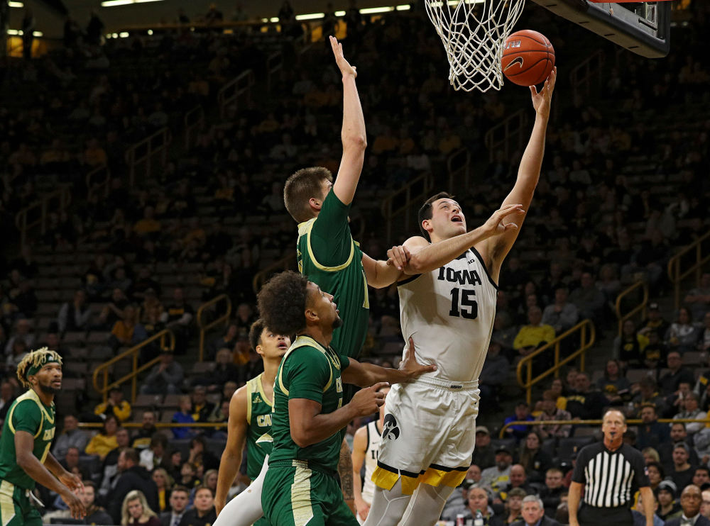 Iowa Hawkeyes forward Ryan Kriener (15) makes a basket during the second half of their game at Carver-Hawkeye Arena in Iowa City on Sunday, Nov 24, 2019. (Stephen Mally/hawkeyesports.com)