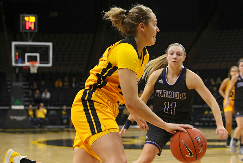 Iowa guard Kathleen Doyle (22) drives in with the ball during the first quarter of their game against Winona State at Carver-Hawkeye Arena in Iowa City on Sunday, Nov 3, 2019. (Stephen Mally/hawkeyesports.com)