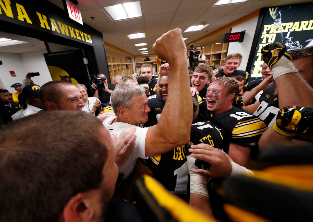 Iowa Hawkeyes head coach Kirk Ferentz celebrates his historic victory with his team following their game against the Northern Illinois Huskies Saturday, September 1, 2018 at Kinnick Stadium. (Brian Ray/hawkeyesports.com)