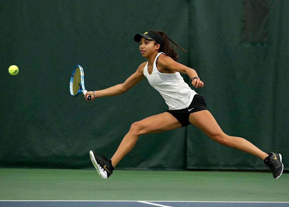 Iowa’s Michelle Bacalla returns a shot during her doubles match at the Hawkeye Tennis and Recreation Complex in Iowa City on Sunday, February 23, 2020. (Stephen Mally/hawkeyesports.com)