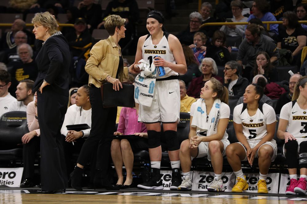 Associate head coach Jan Jensen and forward Megan Gustafson (10) against the Illinois Fighting Illini Thursday, February 14, 2019 at Carver-Hawkeye Arena. (Brian Ray/hawkeyesports.com)