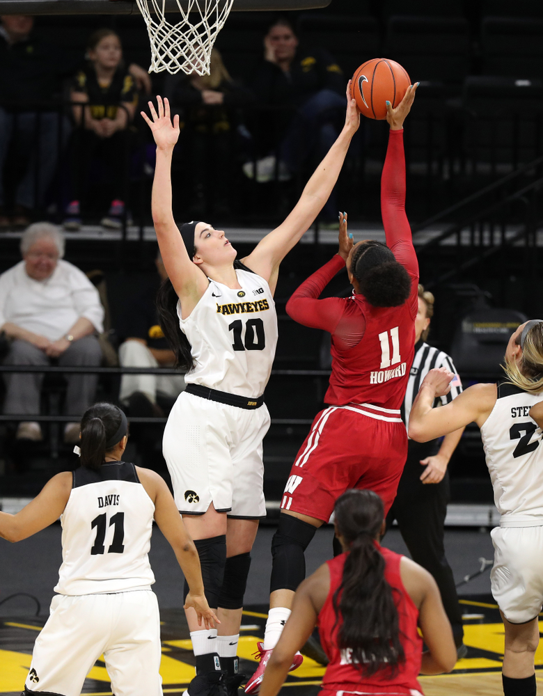 Iowa Hawkeyes forward Megan Gustafson (10) blocks a shot against the Wisconsin Badgers Monday, January 7, 2019 at Carver-Hawkeye Arena. (Brian Ray/hawkeyesports.com)