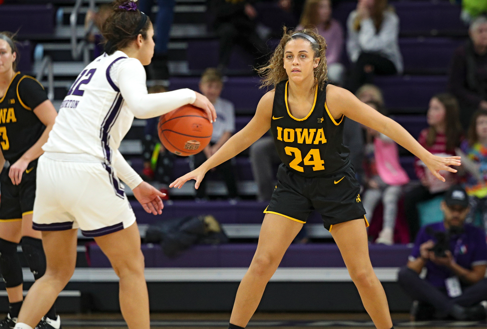 Iowa Hawkeyes guard Gabbie Marshall (24) defends during the third quarter of their game at Welsh-Ryan Arena in Evanston, Ill. on Sunday, January 5, 2020. (Stephen Mally/hawkeyesports.com)