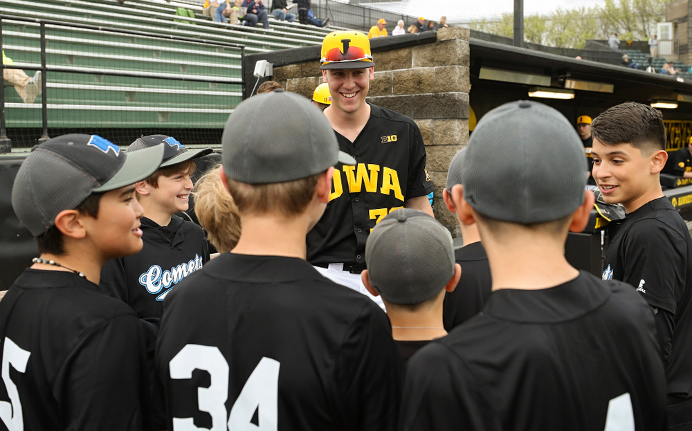 Iowa Hawkeyes right fielder Connor McCaffery (30) talks with some young fans before their game against Western Illinois at Duane Banks Field in Iowa City on Wednesday, May. 1, 2019. (Stephen Mally/hawkeyesports.com)