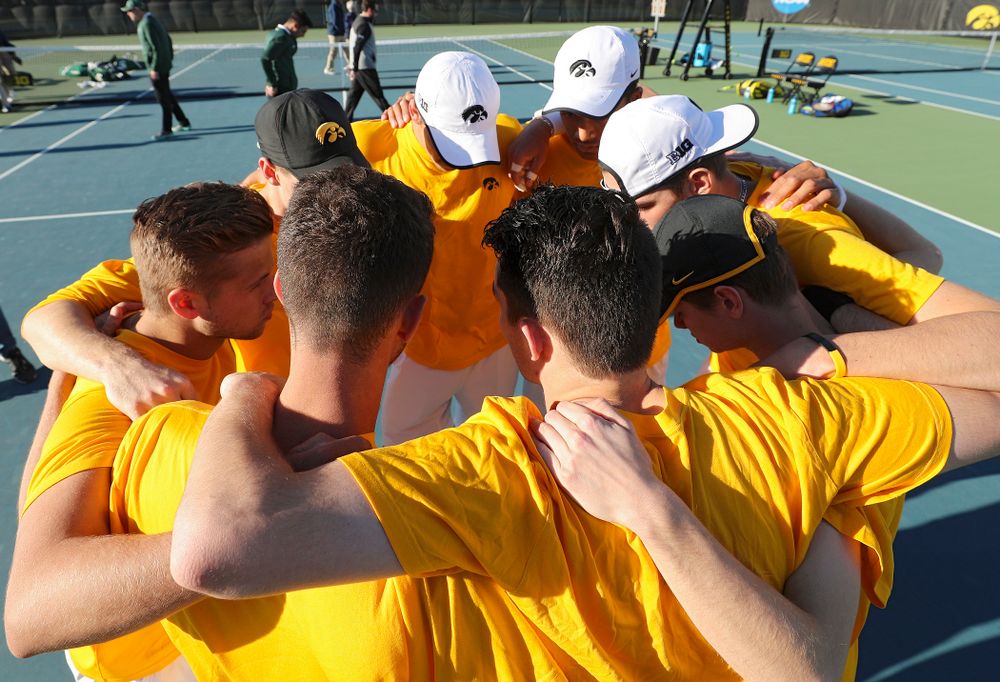 The Iowa Hawkeyes huddle before their match again Michigan State at the Hawkeye Tennis and Recreation Complex in Iowa City on Friday, Apr. 19, 2019. (Stephen Mally/hawkeyesports.com)