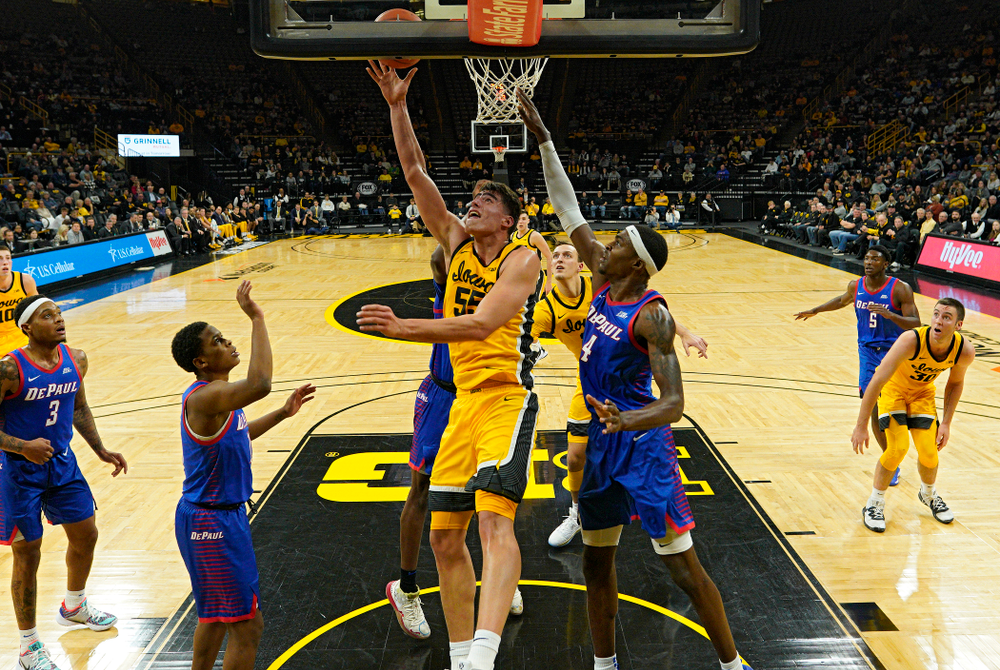 Iowa Hawkeyes center Luka Garza (55) makes a basket inside during the first half of their game at Carver-Hawkeye Arena in Iowa City on Monday, Nov 11, 2019. (Stephen Mally/hawkeyesports.com)