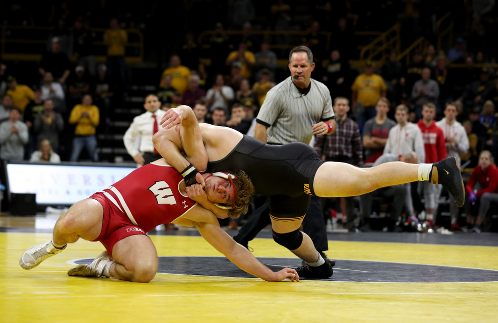 IowaÕs Tony Cassioppi wrestles WisconsinÕs Trent Hillger at heavyweight Sunday, December 1, 2019 at Carver-Hawkeye Arena. Cassioppi won the match 3-2. (Brian Ray/hawkeyesports.com)