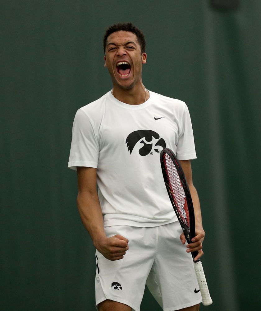 Iowa’s Will Davies and Oliver Okonkwo celebrates a point against Cornell Sunday, March 8, 2020 at the Hawkeye Tennis and Recreation Center. (Brian Ray/hawkeyesports.com)