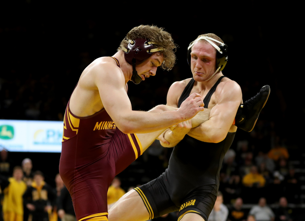 Iowa’s Kaleb Young wrestles Minnesota’s Ryan Thomas at 157 pounds Saturday, February 15, 2020 at Carver-Hawkeye Arena. Young won the match 5-4 in extra time. (Brian Ray/hawkeyesports.com)