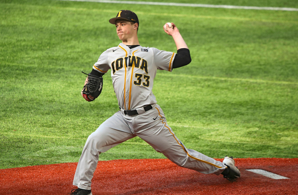 Iowa Hawkeyes pitcher Jack Dreyer (33) delivers to the plate during the first inning of their CambriaCollegeClassic game at U.S. Bank Stadium in Minneapolis, Minn. on Friday, February 28, 2020. (Stephen Mally/hawkeyesports.com)