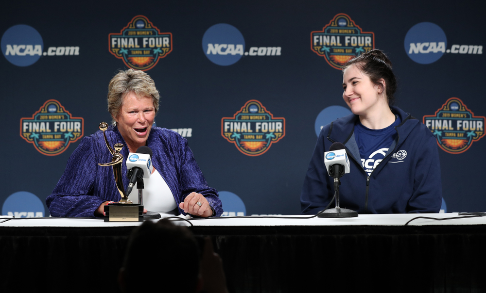 Iowa Hawkeyes forward Megan Gustafson (10) receives US Basketball Writers Association Ann Meyers Drysdale Player of the Year award from Ann Meyers Drysdale during a news conference Friday, April 5, 2019 at Amalie Arena in Tampa, FL. (Brian Ray/hawkeyesports.com)