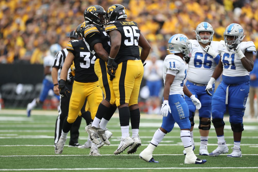 Iowa Hawkeyes defensive lineman Cedrick Lattimore (95) and linebacker Djimon Colbert (32) against Middle Tennessee State Saturday, September 28, 2019 at Kinnick Stadium. (Max Allen/hawkeyesports.com)