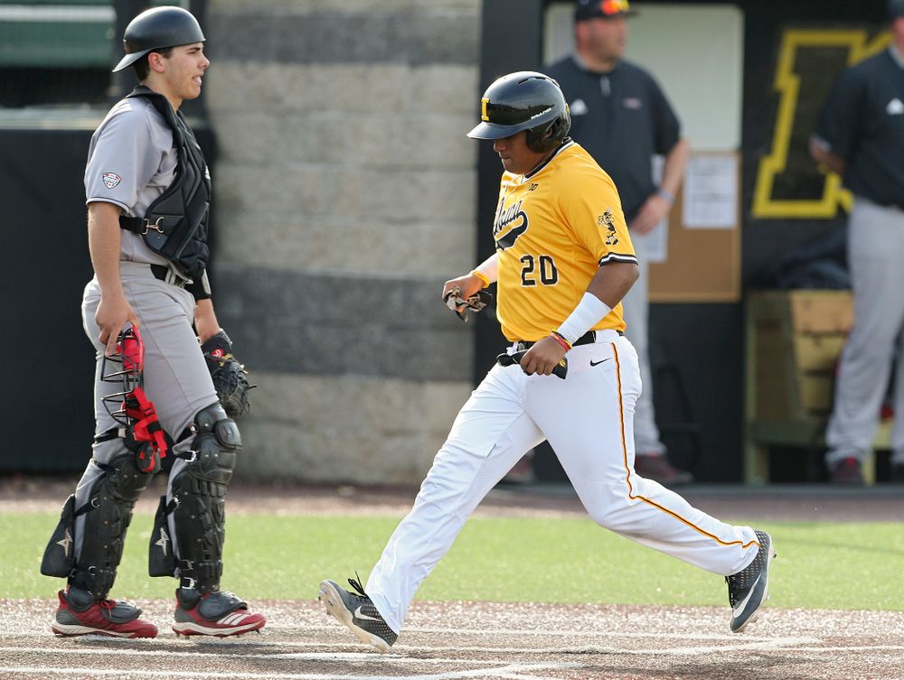 Iowa Hawkeyes first baseman Izaya Fullard (20) scores a run during the third inning of their game against Northern Illinois at Duane Banks Field in Iowa City on Tuesday, Apr. 16, 2019. (Stephen Mally/hawkeyesports.com)