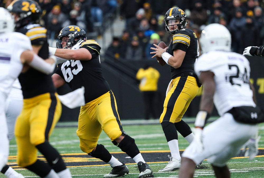 Iowa Hawkeyes quarterback Nate Stanley (4) drops back to pass during a game against Northwestern at Kinnick Stadium on November 10, 2018. (Tork Mason/hawkeyesports.com)