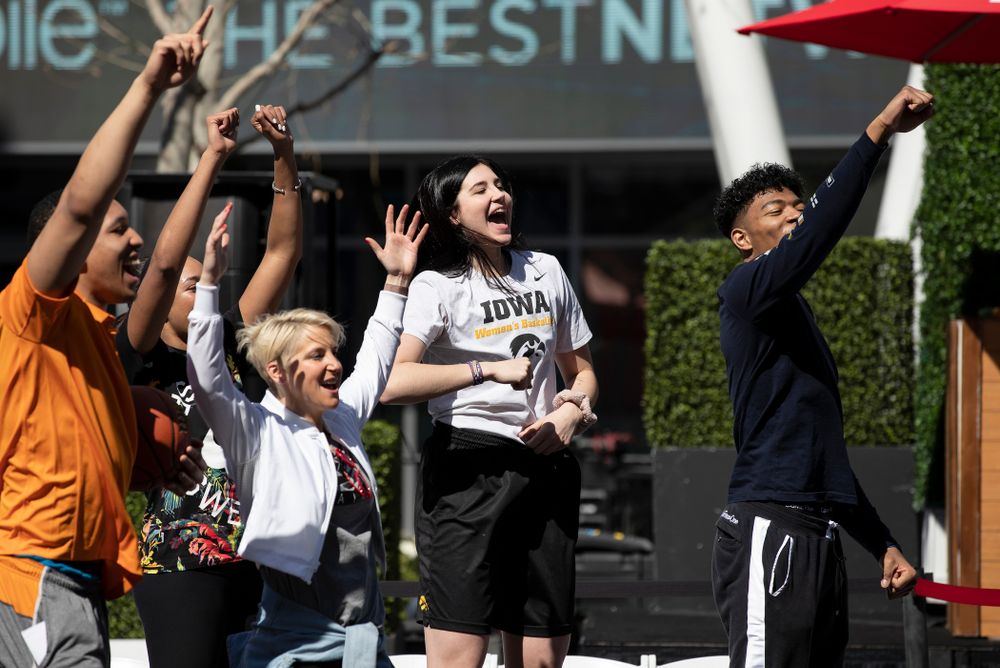 Iowa Hawkeyes forward Megan Gustafson (10) cheers on the athletes during a Special Olympics Event Friday, April 12, 2019 in the XBOX Plaza at LA Live. (Brian Ray/hawkeyesports.com)