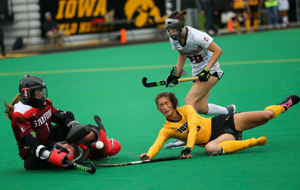 Iowa Hawkeyes forward Isabella Solaroli (16) is tripped near the goal during a game against Stanford at Grant Field on October 7, 2018. (Tork Mason/hawkeyesports.com)