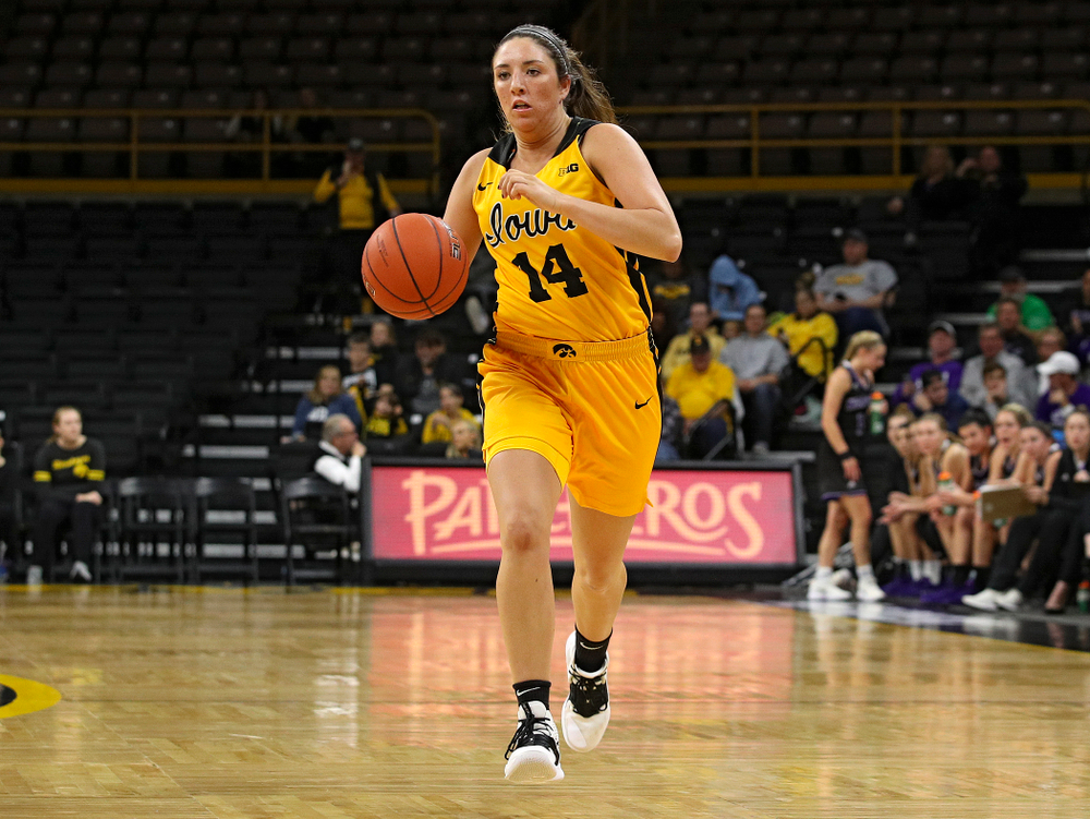 Iowa guard/forward McKenna Warnock (14) brings the ball down the court during the third quarter of their game against Winona State at Carver-Hawkeye Arena in Iowa City on Sunday, Nov 3, 2019. (Stephen Mally/hawkeyesports.com)