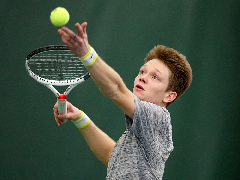 Iowa’s Jason Kerst serves during their match at the Hawkeye Tennis and Recreation Complex in Iowa City on Thursday, January 16, 2020. (Stephen Mally/hawkeyesports.com)