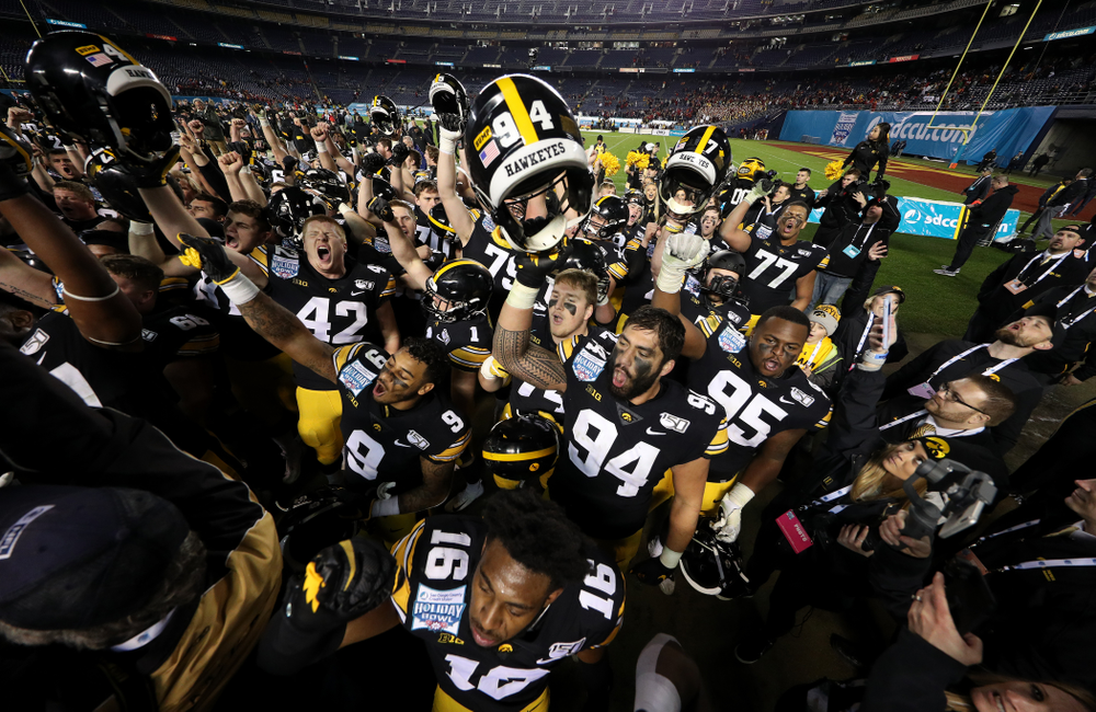 The Iowa Hawkeyes sing the Fight Song after their win against USC in the Holiday Bowl Friday, December 27, 2019 at San Diego Community Credit Union Stadium. (Brian Ray/hawkeyesports.com)