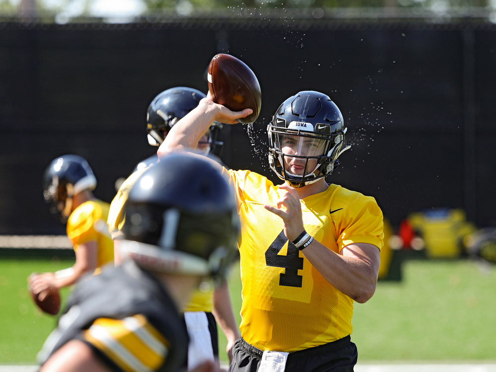 Iowa Hawkeyes quarterback Nate Stanley (4) throws a wet football as they run a drill during Fall Camp Practice No. 13 at the Hansen Football Performance Center in Iowa City on Friday, Aug 16, 2019. (Stephen Mally/hawkeyesports.com)