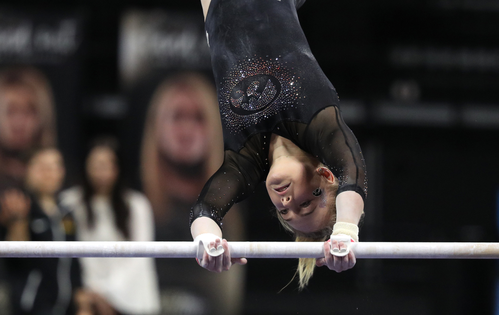 Iowa's Charlotte Sullivan competes on the bars during their meet against the Minnesota Golden Gophers Saturday, January 19, 2019 at Carver-Hawkeye Arena. (Brian Ray/hawkeyesports.com)