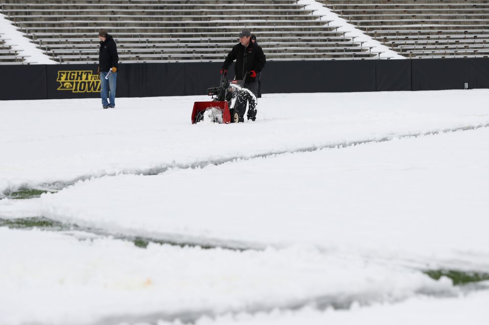 Members of the Iowa Athletics Turf Management staff create the #SnowWave for kids in the Stead Family Children's Hospital Thursday, February