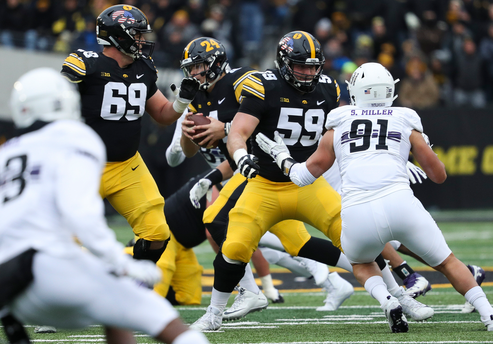 Iowa Hawkeyes offensive lineman Ross Reynolds (59) blocks during a game against Northwestern at Kinnick Stadium on November 10, 2018. (Tork Mason/hawkeyesports.com)