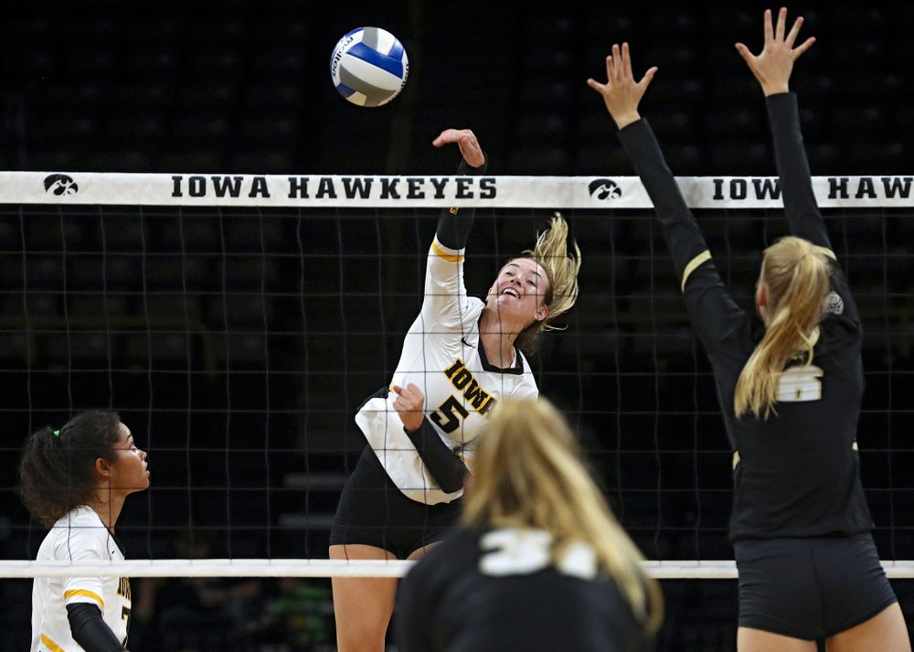 Iowa’s Meghan Buzzerio (5) goes up for a kill during the first set of their Big Ten/Pac-12 Challenge match against Colorado at Carver-Hawkeye Arena in Iowa City on Friday, Sep 6, 2019. (Stephen Mally/hawkeyesports.com)