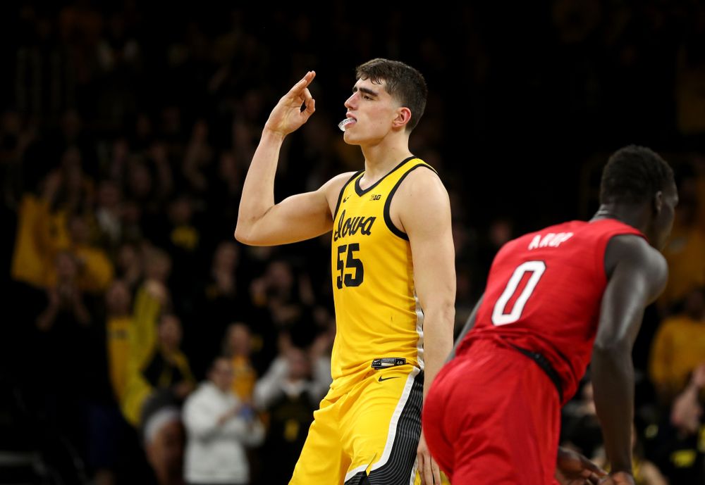 Iowa Hawkeyes forward Luka Garza (55) celebrates a three point basket against the Nebraska Cornhuskers Saturday, February 8, 2020 at Carver-Hawkeye Arena. (Brian Ray/hawkeyesports.com)