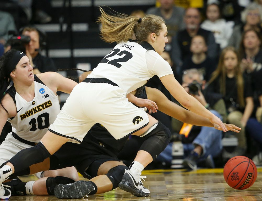 Iowa Hawkeyes guard Kathleen Doyle (22) tries to grab a loose ball during the third quarter of their second round game in the 2019 NCAA Women's Basketball Tournament at Carver Hawkeye Arena in Iowa City on Sunday, Mar. 24, 2019. (Stephen Mally for hawkeyesports.com)