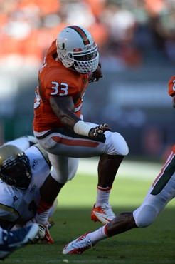 University of Miami Hurricanes running back Maurice Hagens #33 and the Canes take on the Georgia Tech Yellow Jackets at Sun Life Stadium on October 5,...