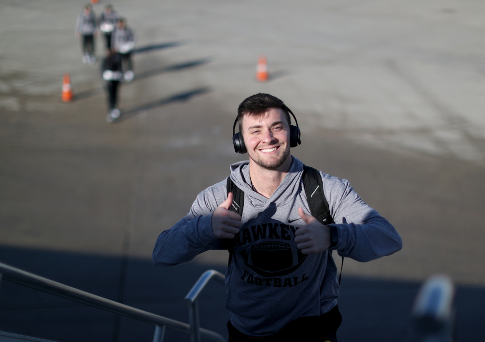 Iowa Hawkeyes place kicker Keith Duncan (3) boards the team plane at the Eastern Iowa Airport Saturday, December 21, 2019 on the way to San Diego, CA for the Holiday Bowl. (Brian Ray/hawkeyesports.com)