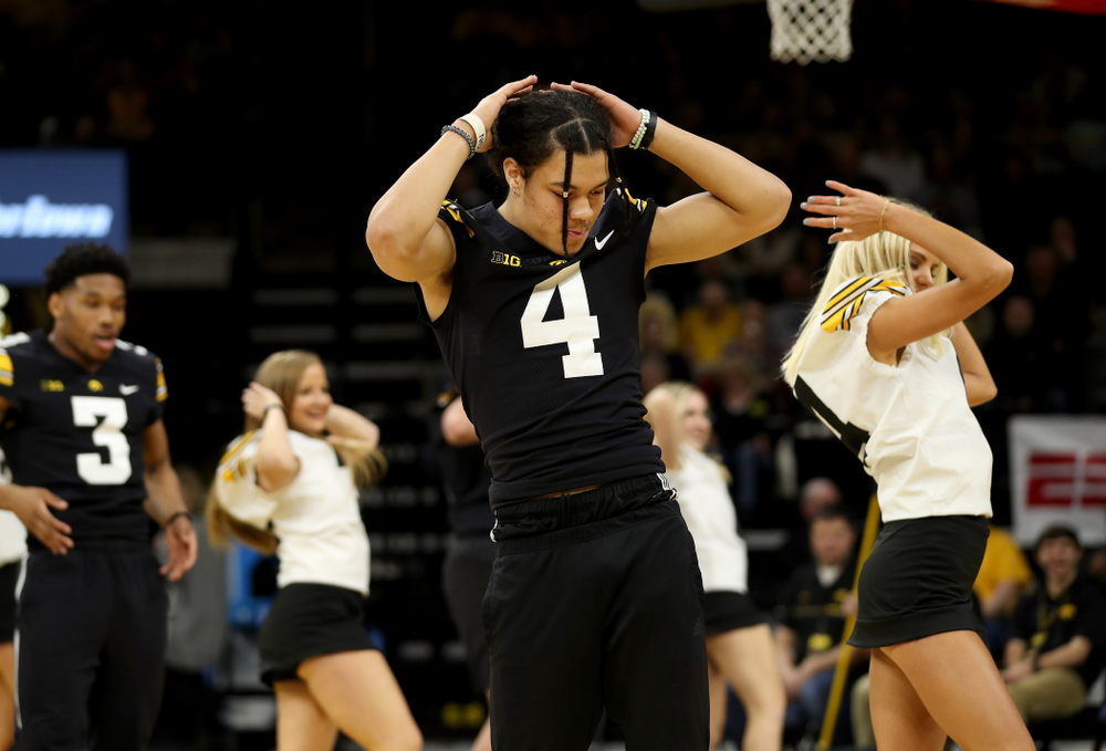 Members of the Hawkeye Football team performs with the Iowa Dance Team at halftime of the Iowa Hawkeyes game against the Ohio State Buckeyes Thursday, February 20, 2020 at Carver-Hawkeye Arena. (Brian Ray/hawkeyesports.com)