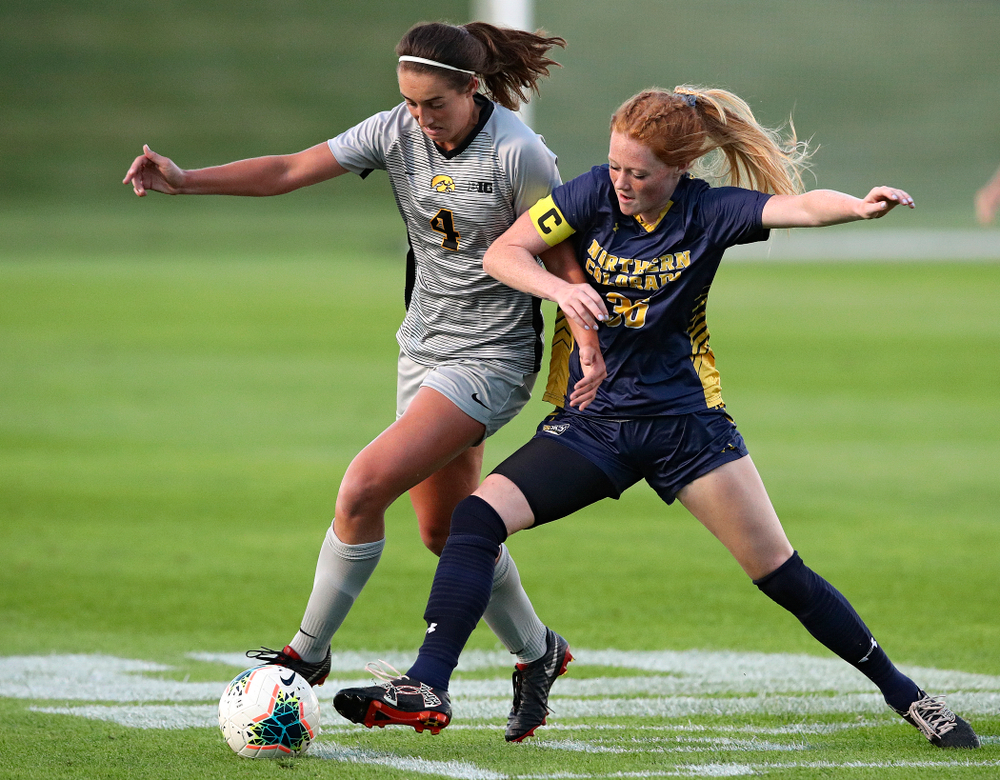 Iowa forward Kaleigh Haus (4) tries to get around a defender during the first half of their match at the Iowa Soccer Complex in Iowa City on Friday, Sep 13, 2019. (Stephen Mally/hawkeyesports.com)