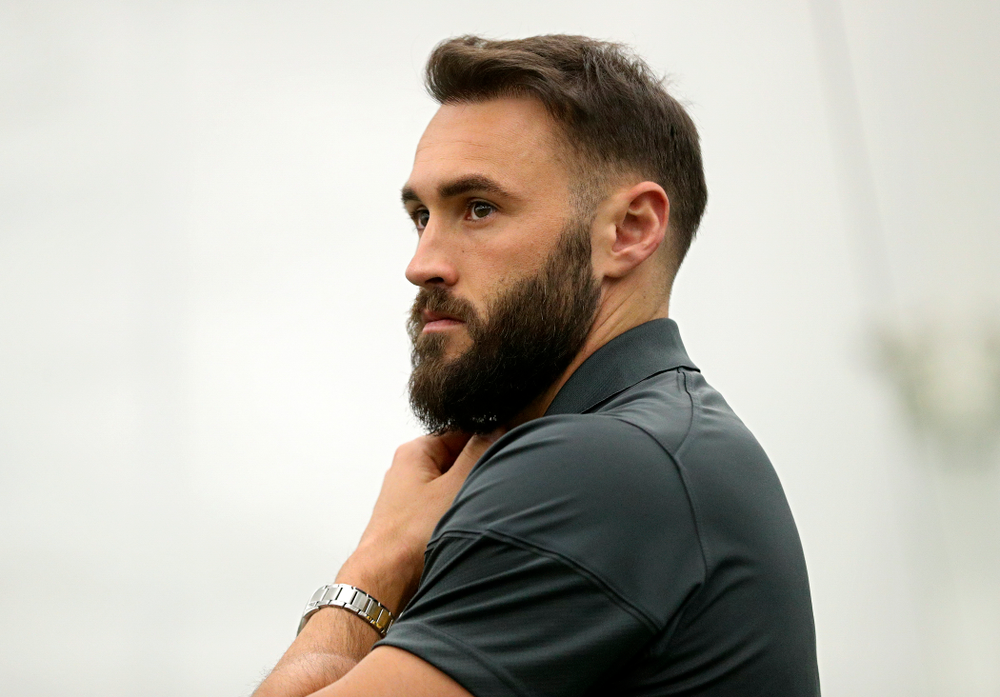 Iowa’s assistant coach Lloyd Bruce-Burgess looks on during a singles match at the Hawkeye Tennis and Recreation Complex in Iowa City on Friday, February 14, 2020. (Stephen Mally/hawkeyesports.com)