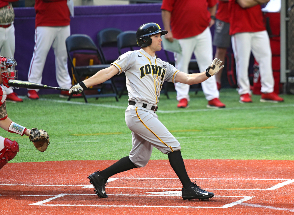Iowa Hawkeyes outfielder Justin Jenkins (6) hits an RBI double during the seventh inning of their CambriaCollegeClassic game at U.S. Bank Stadium in Minneapolis, Minn. on Friday, February 28, 2020. (Stephen Mally/hawkeyesports.com)