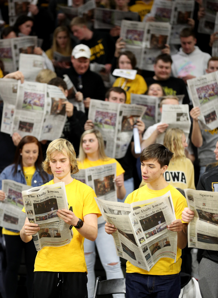 The Hawksnest reads copies of the Daily Iowan during introductions before the Iowa Hawkeyes game against the Michigan Wolverines Friday, January 17, 2020 at Carver-Hawkeye Arena. (Brian Ray/hawkeyesports.com)