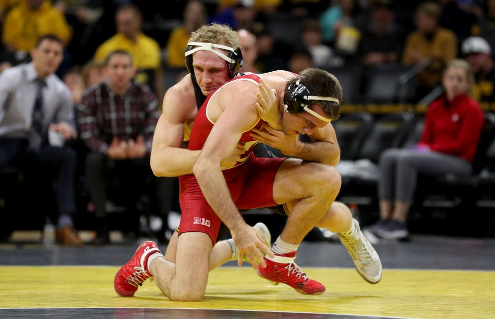 IowaÕs Kaleb Young wrestles WisconsinÕs Garrett Model at 157 pounds Sunday, December 1, 2019 at Carver-Hawkeye Arena. Young won the match 12-6. (Brian Ray/hawkeyesports.com)