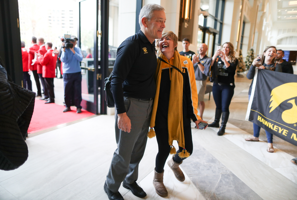Iowa Hawkeyes head coach Kirk Ferentz takes photos with fans after arriving in San Diego, CA Saturday, December 21, 2019 for the Holiday Bowl. (Brian Ray/hawkeyesports.com)