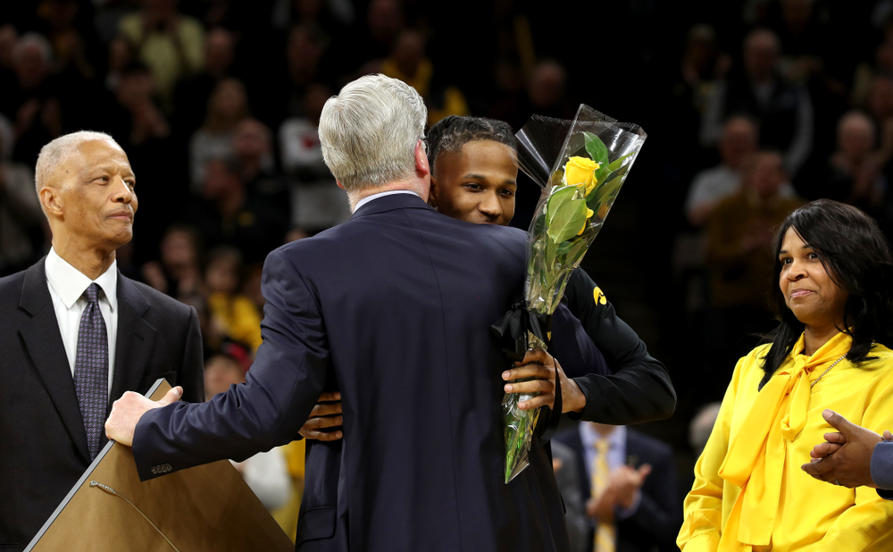 Iowa Hawkeyes guard Bakari Evelyn (4) and his family during senior night festivities before their game against the Purdue Boilermakers Tuesday, March 3, 2020 at Carver-Hawkeye Arena. (Brian Ray/hawkeyesports.com)